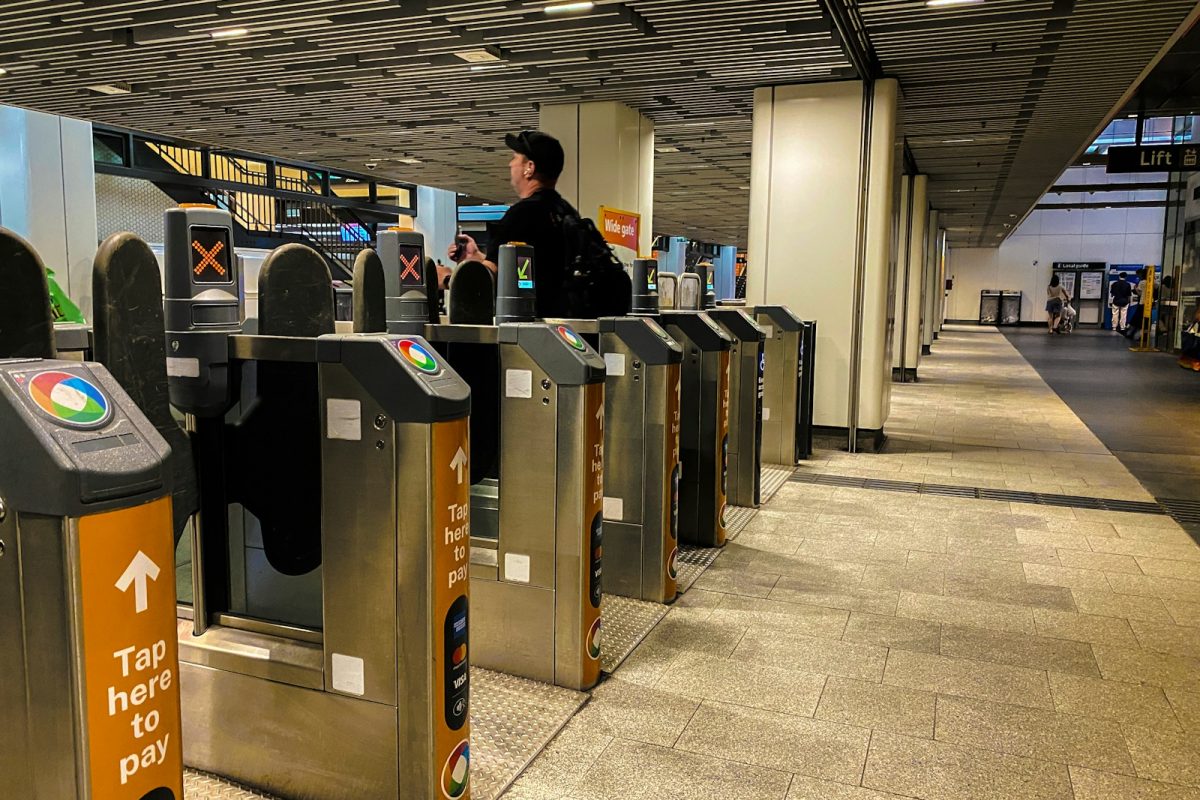 A security officer is standing at the check in area